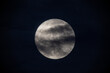 © Rafael Prendes - photograph of the full moon partially covered with clouds