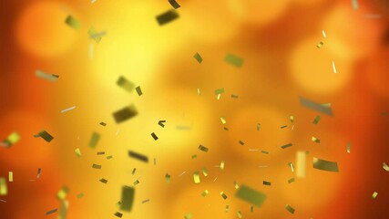 Wall Mural - Golden confetti falling animation over blurred orange and yellow background