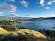 © Veronika Gaudet - View from Knox Mountain of Kelowna cityscape with Okanagan Lake and a blue sky above