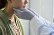 © pressmaster - Healthcare professional examining patient's neck with medical gloves inside an examination room during a routine check-up for thyroid and lymph node inspection