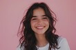 © Fotograf - A happy woman with long hair smiling directly at the camera