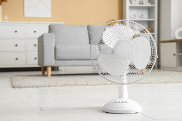 Poster - Modern electric fan on floor in interior of living room