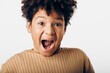 © SHOTPRIME STUDIO - joyful african american boy expresses excitement with wide open mouth against a clean white background