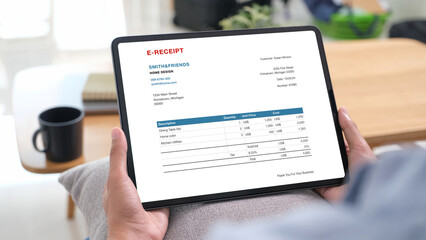 Woman hand using digital tablet with E ceceipt on screen, Telefinance, Business technology and lifestyle