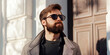 © HelgaQ - Stylish Bearded Man in Sunglasses and Coat Standing Outdoors on a Sunny Day