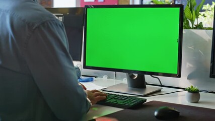 Wall Mural - Unknown freelancer working green screen computer in modern workplace closeup