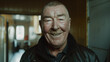 © Inovop - Endearing portrait of rugged older gentleman beaming with joy in indoor setting