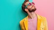 © Tati - Bearded man wearing colorful outfit and sunglasses posing confidently against vibrant background