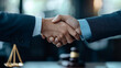 © NongKirana - A firm handshake symbolizes agreement and partnership in professional setting, conveying trust and collaboration.