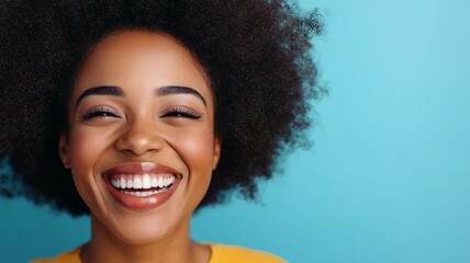 Wall Mural - A woman with curly hair is smiling and has her mouth open