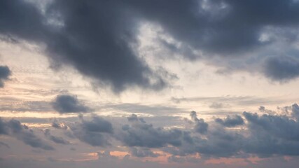 Wall Mural - timelapse of dramatic sunrise with orange sky in a cloudy day at the ocean.