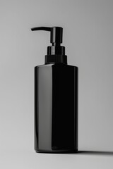 Wall Mural - A black bottle filled with liquid sitting on a white surface