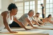 © Anna - Diverse Group Practicing Yoga Indoors for Fitness and Wellbeing - Multicultural Wellness Session