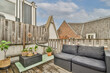© ADDICTIVE STOCK - Cozy rooftop terrace with comfortable seating and plants