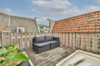 © ADDICTIVE STOCK - Comfortable Rooftop Terrace with Rustic Charm