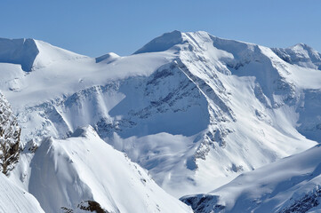 Snow covered mountain slopes in the Alps