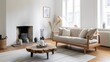 © BISO - A modern Scandinavian living room with a wood slab coffee table and a sofa with beige pillows near a fireplace against a whitewall. A wooden floor and a few decorative item.