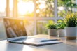 © Anton - Laptop on desk with sunlight and plants