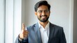 © NHA Studio - Indian Man in Legal Setting Giving Thumbs Up