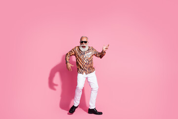 Poster - Photo of excited grandfather dancing imagine playing rock guitar isolated pastel color background