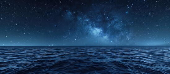 Poster - Starry night sky over blue ocean background with copy space image