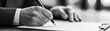 © Framefolio - Business hand holding a pen over a contract, signing document. Hand holding pen and signing legal contract agreement