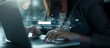 © IBEX.Media - A businesswoman typing on a laptop with a floating virtual search bar surrounded by digital elements, symbolizing the integration of technology and modern business practices in a dynamic environment