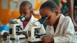 © Mellow Frame Gallery - Two young children using a microscope in a classroom. Attractive multicultural children learning and doing experiment while looking at microscope. Education and science learning concept. AIG53.
