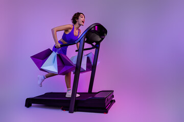 Photo of sporty girl run fast with shopping bags impressed special sport equipment offer isolated neon color background