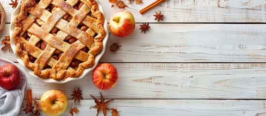 Aufkleber - Apple pie in a baking dish with ingredients set on a white wooden background providing a beautiful copy space image