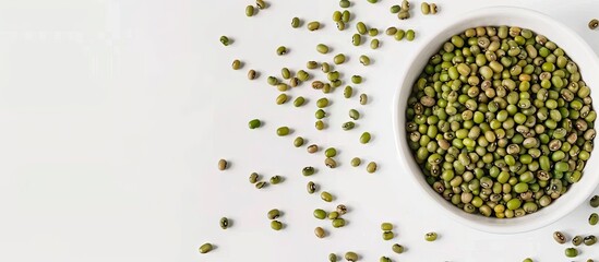 Poster - White bowl with organic mung bean and green moong dal on a white background with copy space image