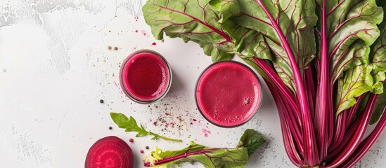Aufkleber - Flat lay of ripe vegetables and a glass of fresh beet juice on a white table providing ample copy space for text