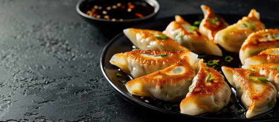 Canvas Print - Selective focus on gyoza or dumplings with soy sauce in a copy space image