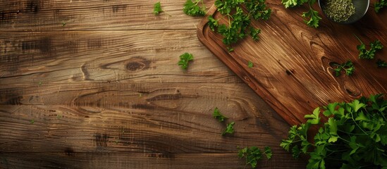 Poster - Top view of a wooden table with a cutting board cumin and parsley providing copy space for text