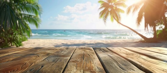 Poster - Ideal for showcasing summer products a wooden table with a blurred tropical beach backdrop featuring palm trees creating a fitting copy space image