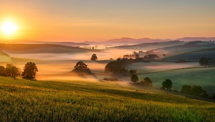 Wall Mural - peaceful foggy sunrise over scenic countryside and farmland