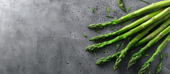 Aufkleber - Top view of fresh asparagus on a concrete surface with copy space image