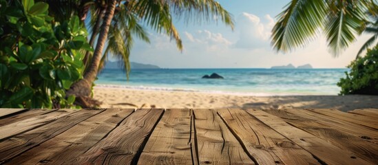 Poster - A wooden table against a tropical beach backdrop of sandy shores and palm trees creates a captivating summer copy space image