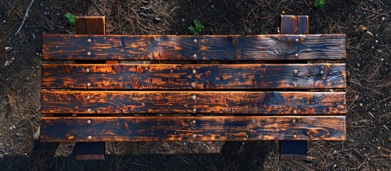 Wall Mural - aerial perspective of a rustic wooden picnic table in the backyard with copy space image