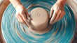 © suratin - Pottery Wheel with Hands Shaping Clay.