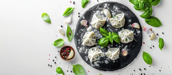 Poster - Blackboard with uncooked dumplings and basil on a white backdrop creating a visually appealing copy space image