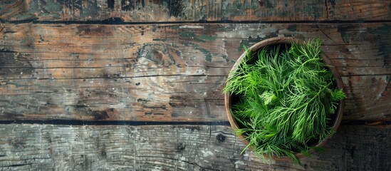 Poster - Top view of a bowl with freshly cut dill on a wooden table with room for text in the image. Creative banner. Copyspace image