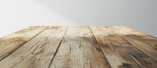 Poster - A view of a wooden table s corner isolated against a white backdrop provides a fresh copy space image