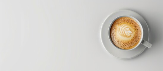 Poster - Cappuccino coffee in a cup on a white background with copy space image