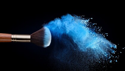 make up brush with blue powder explosion isolated on black background