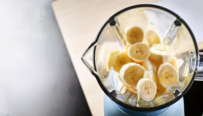 Wall Mural - making a banana smoothie with ice in a blender