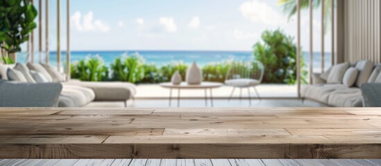 Fototapete - Blurred background of a modern coastal living room enhances the empty table top as an ideal copy space image for advertising and product displays