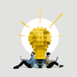 © svetazi - A man and a woman with laptops sit near a large light bulb made of blocks. Art collage.