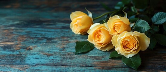 Wall Mural - Yellow roses on an antique wooden table. with copy space image. Place for adding text or design