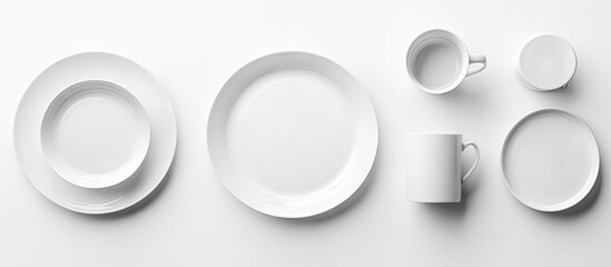 Fototapete - Ceramic tableware design Blank plates and mugs on a white background top view copyspace